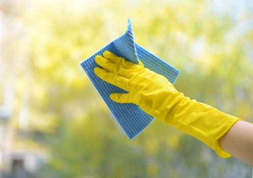 Step-by-step mattress cleaning process in a bedroom setting